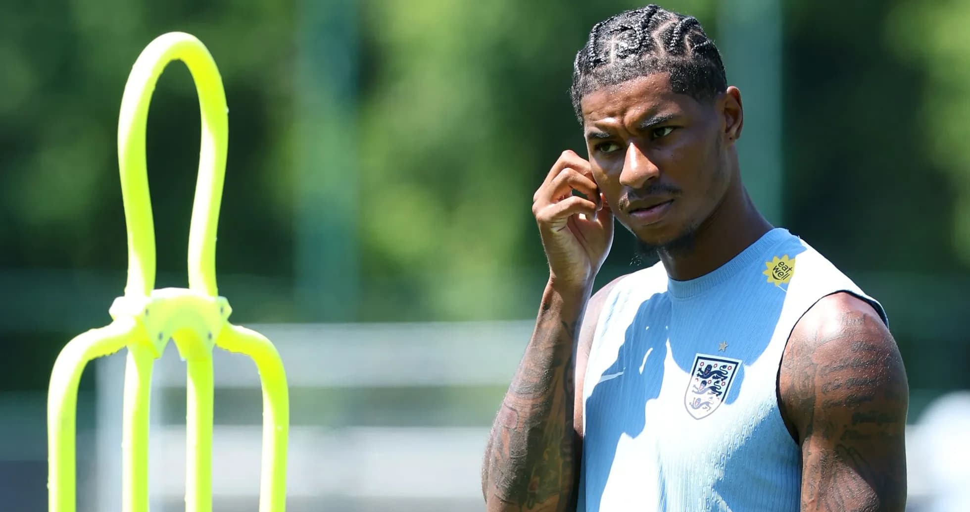 Player listening during training session with cones