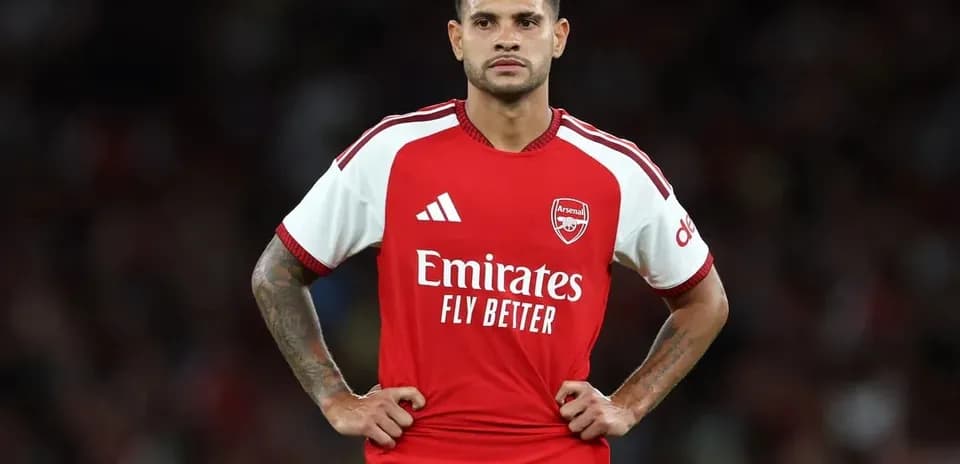 Player in Arsenal jersey standing on field