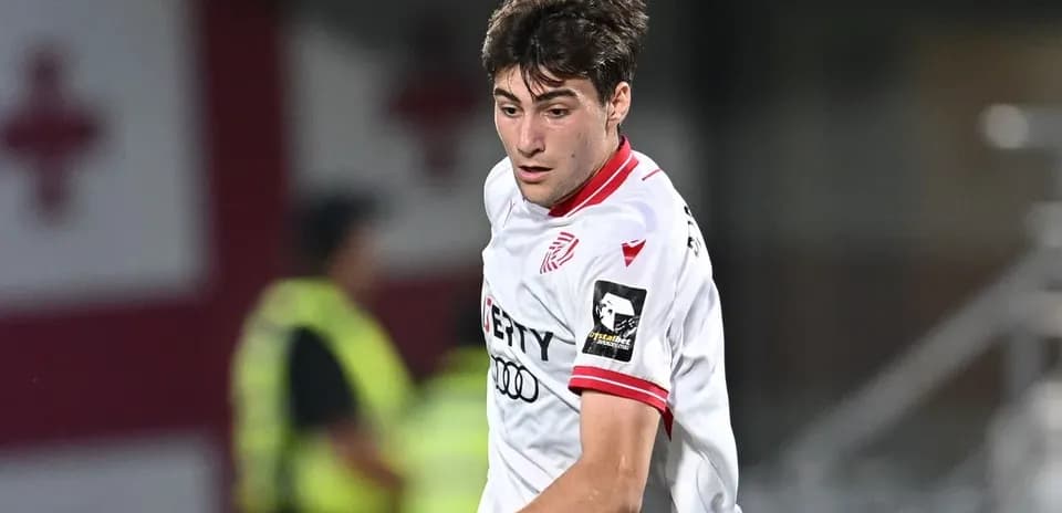 Player in white jersey during a football match