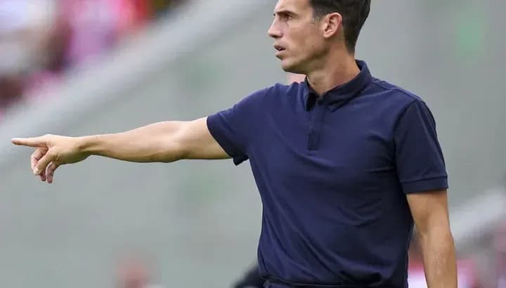 Coach directing players from the sidelines during match