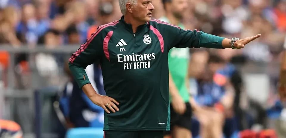 Coach directing players from the sideline during match