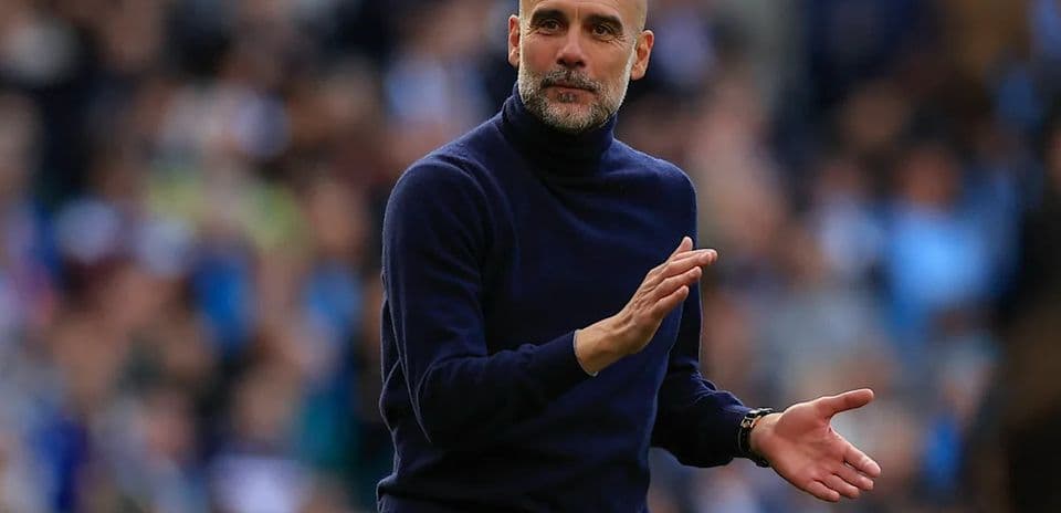 Manager gesturing on the sidelines during match