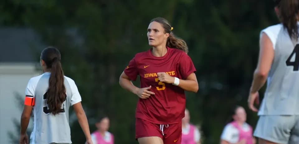 Iowa State player running on the field during match