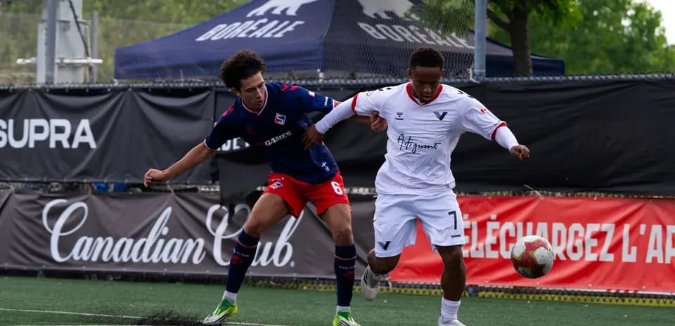Players competing for the ball during match