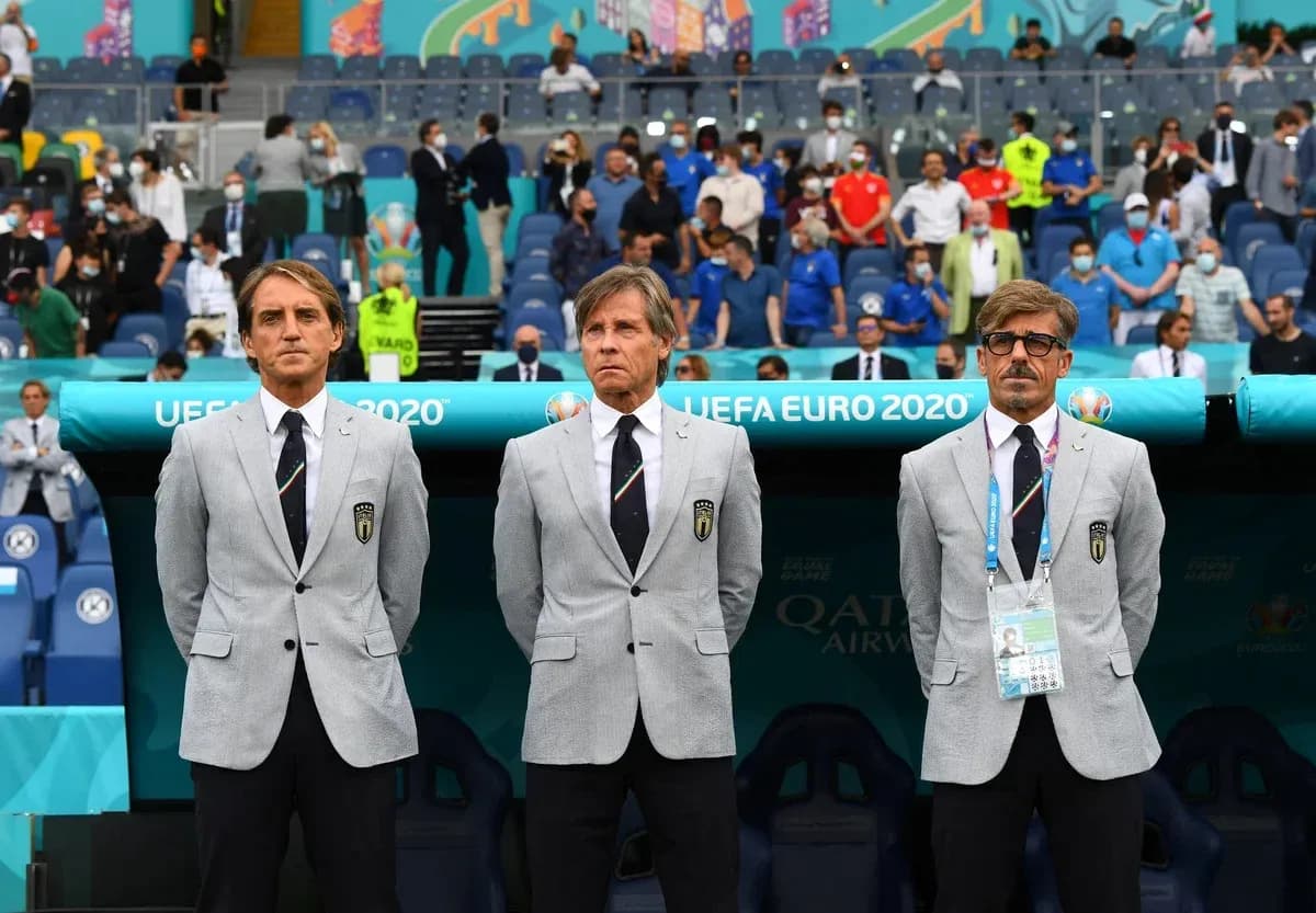 Coaching staff standing before UEFA Euro 2020 match