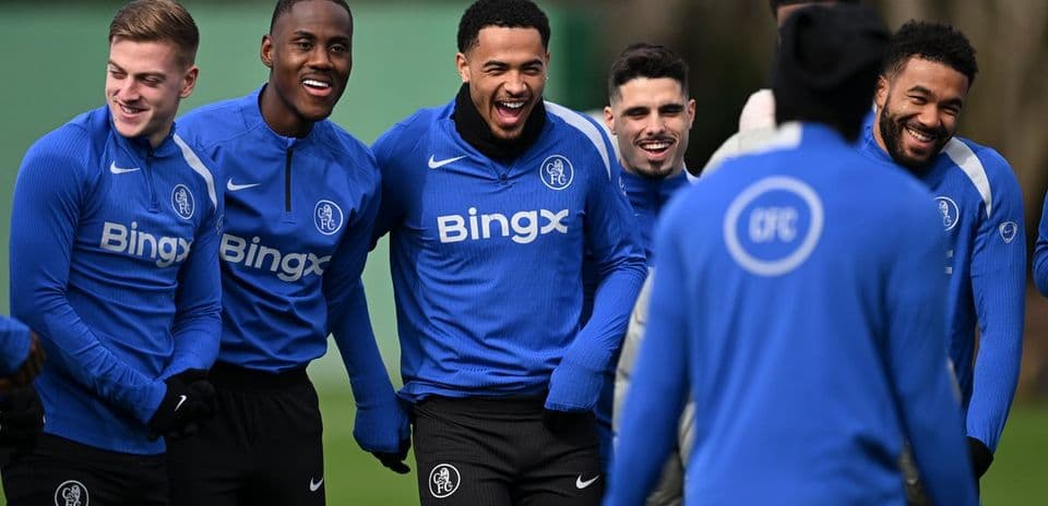 Players laughing during training session at facility