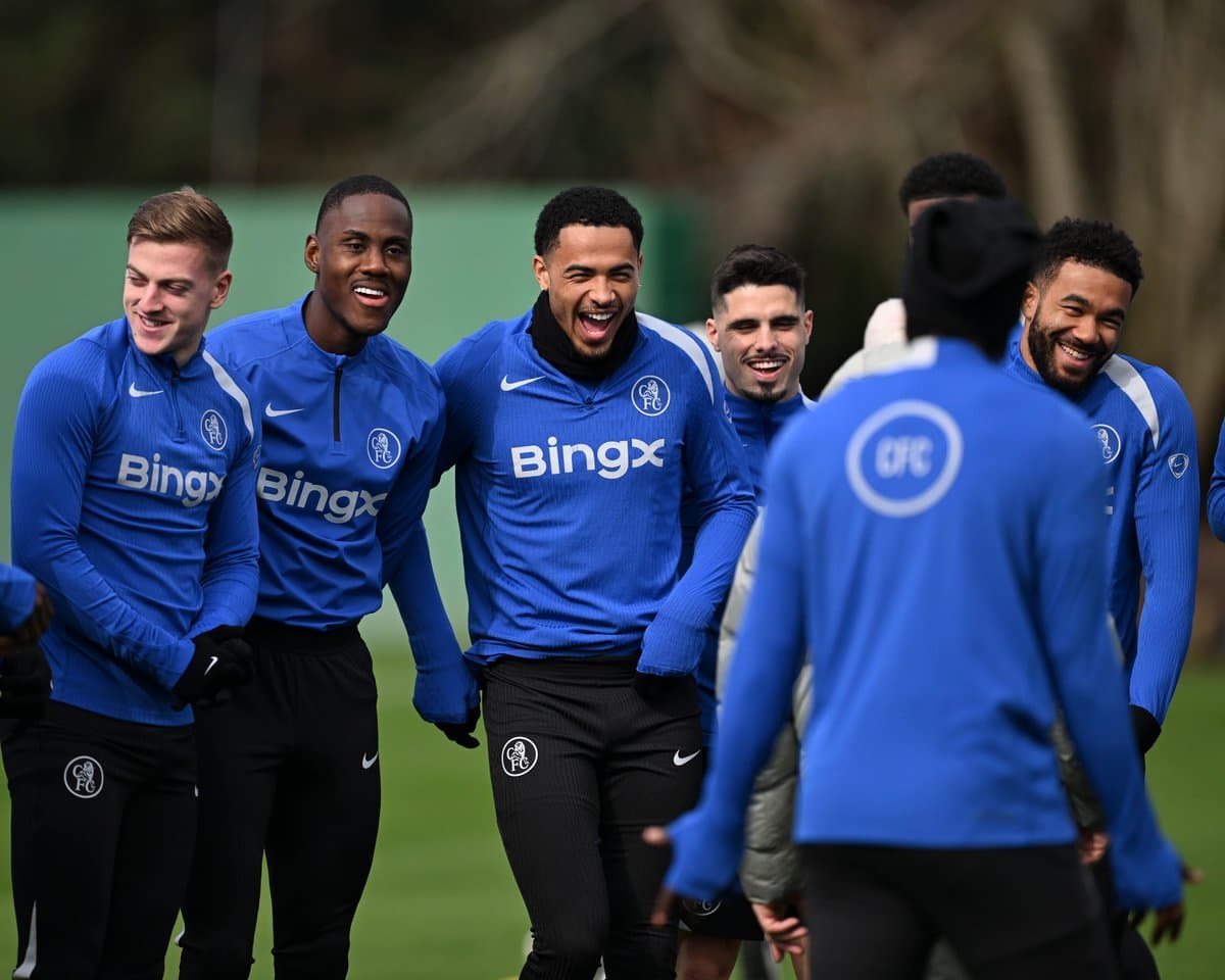 Players laughing during training session at facility