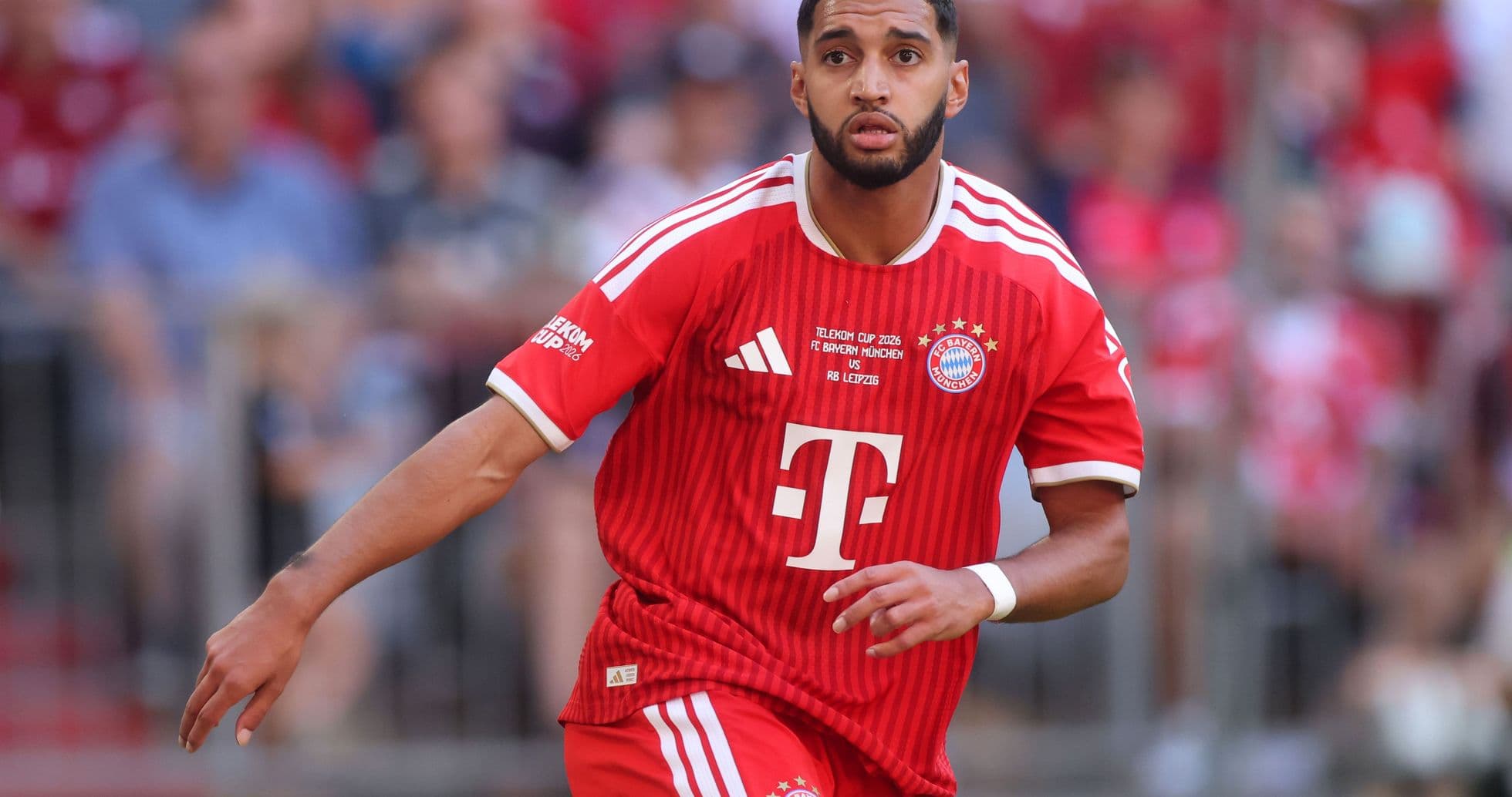 Player running in Bayern Munich's red jersey during match