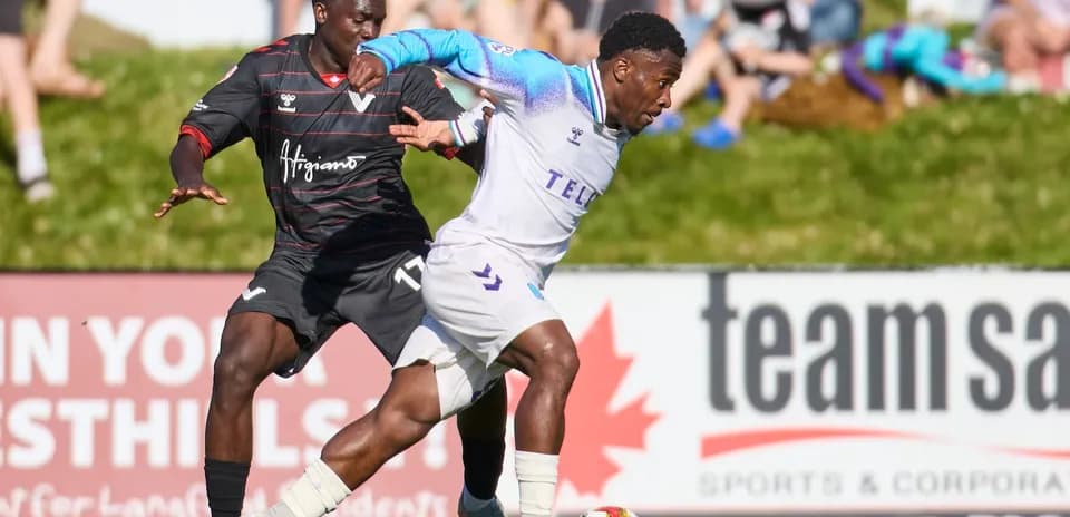 Player dribbling past opponent during match