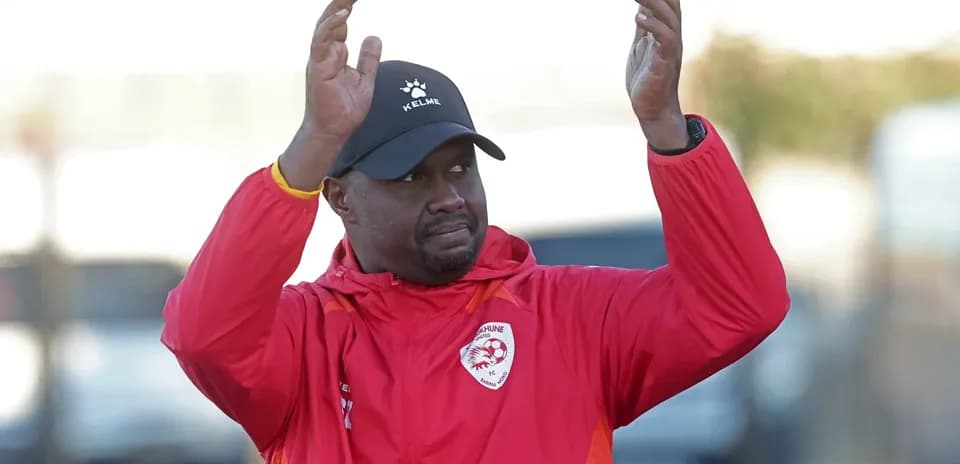 Coach applauding during training session outdoors