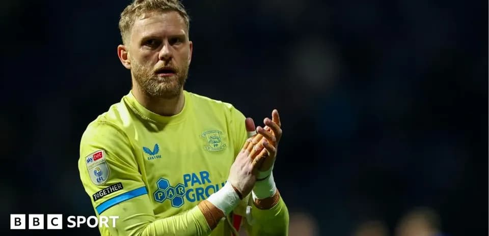 Goalkeeper clapping after a match wearing yellow kit