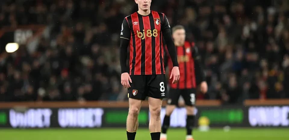 Bournemouth player standing on pitch during match