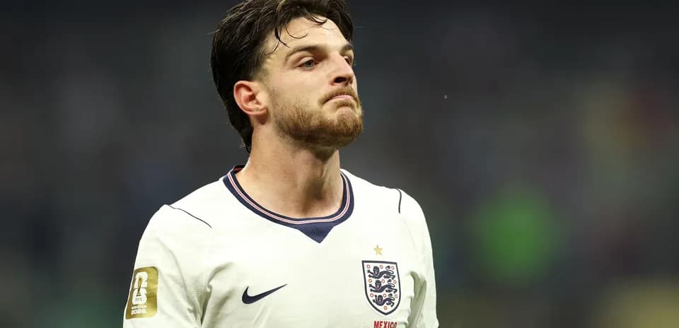 Player in England kit during match on field