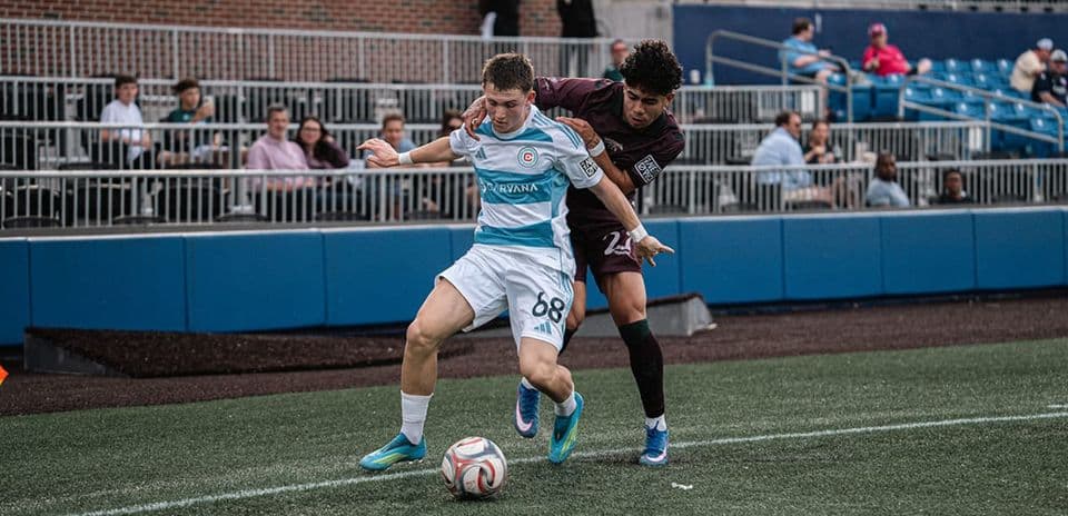 Player battling for the ball during match