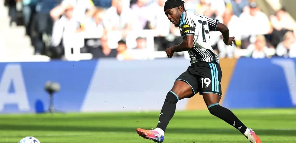 Newcastle player kicking the ball during match