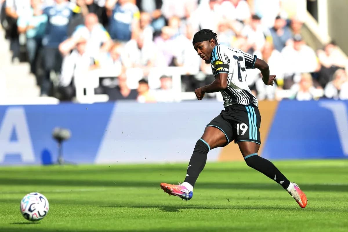 Newcastle player kicking the ball during match