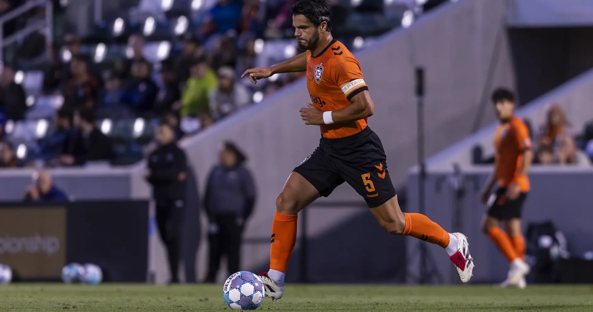 Player dribbling the ball during New Mexico match
