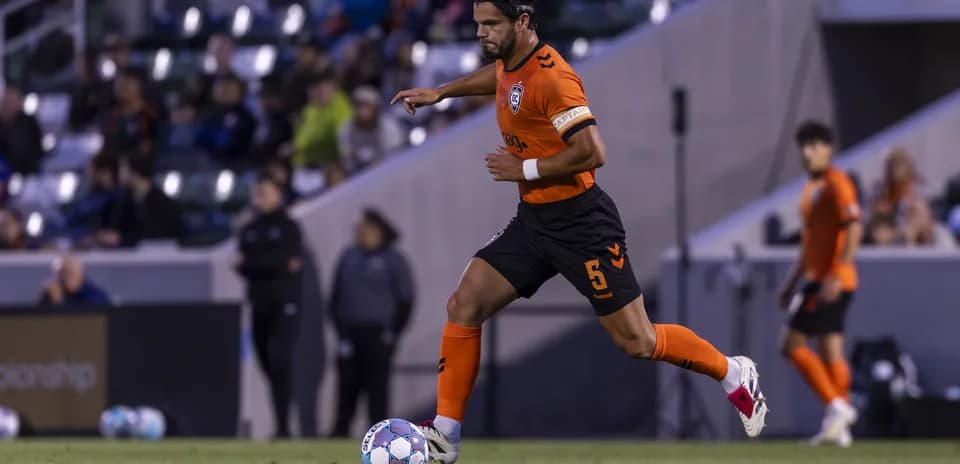 Player dribbling the ball during New Mexico match