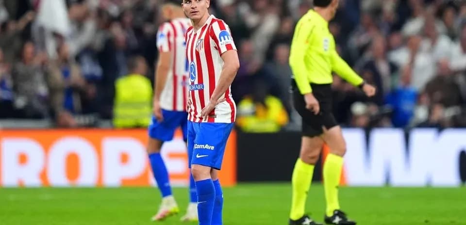 Atletico Madrid player looking disappointed on pitch