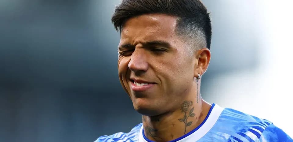 Player with tattoos smiling during warm-up