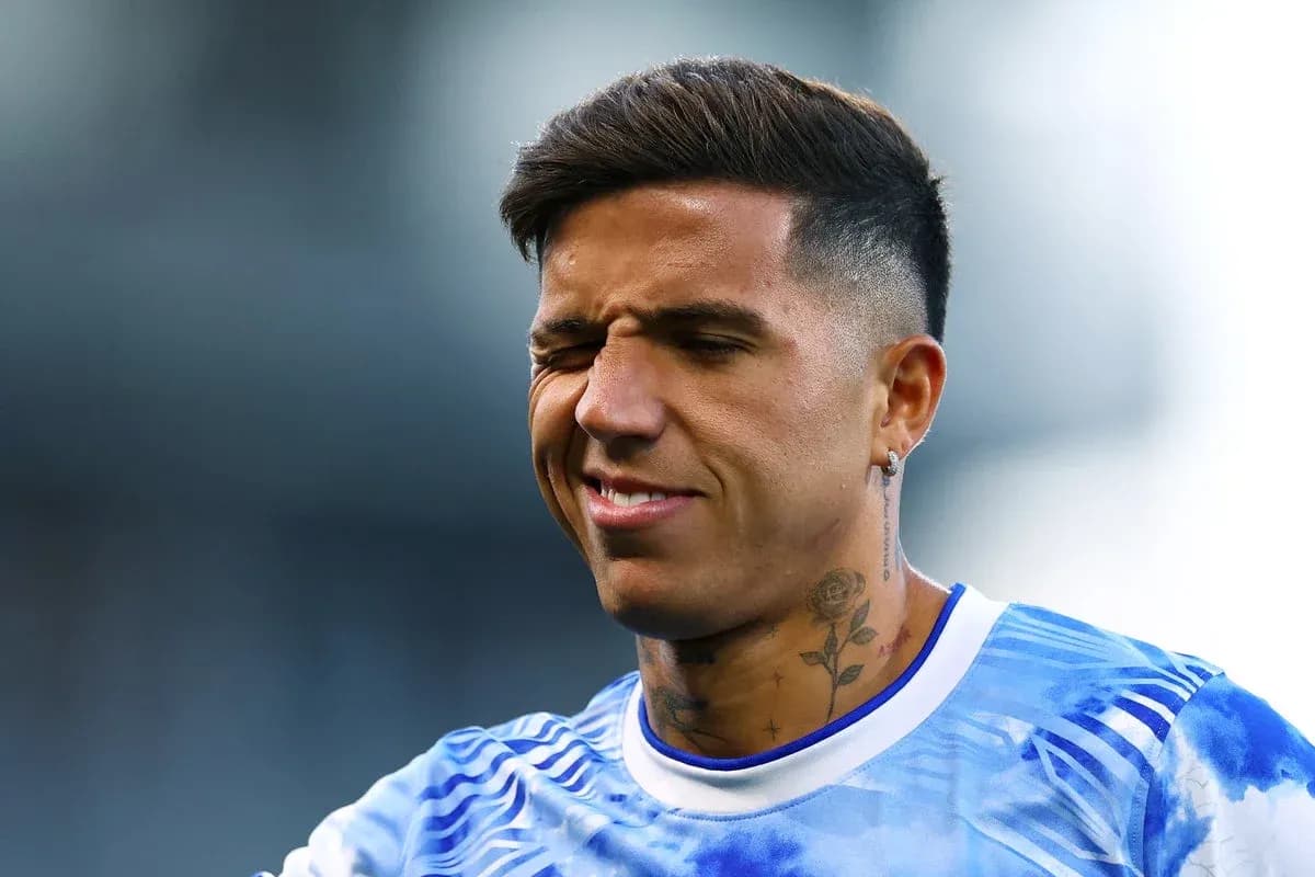 Player with tattoos smiling during warm-up