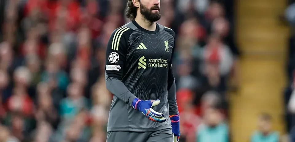 Goalkeeper Alisson Becker walking on the pitch