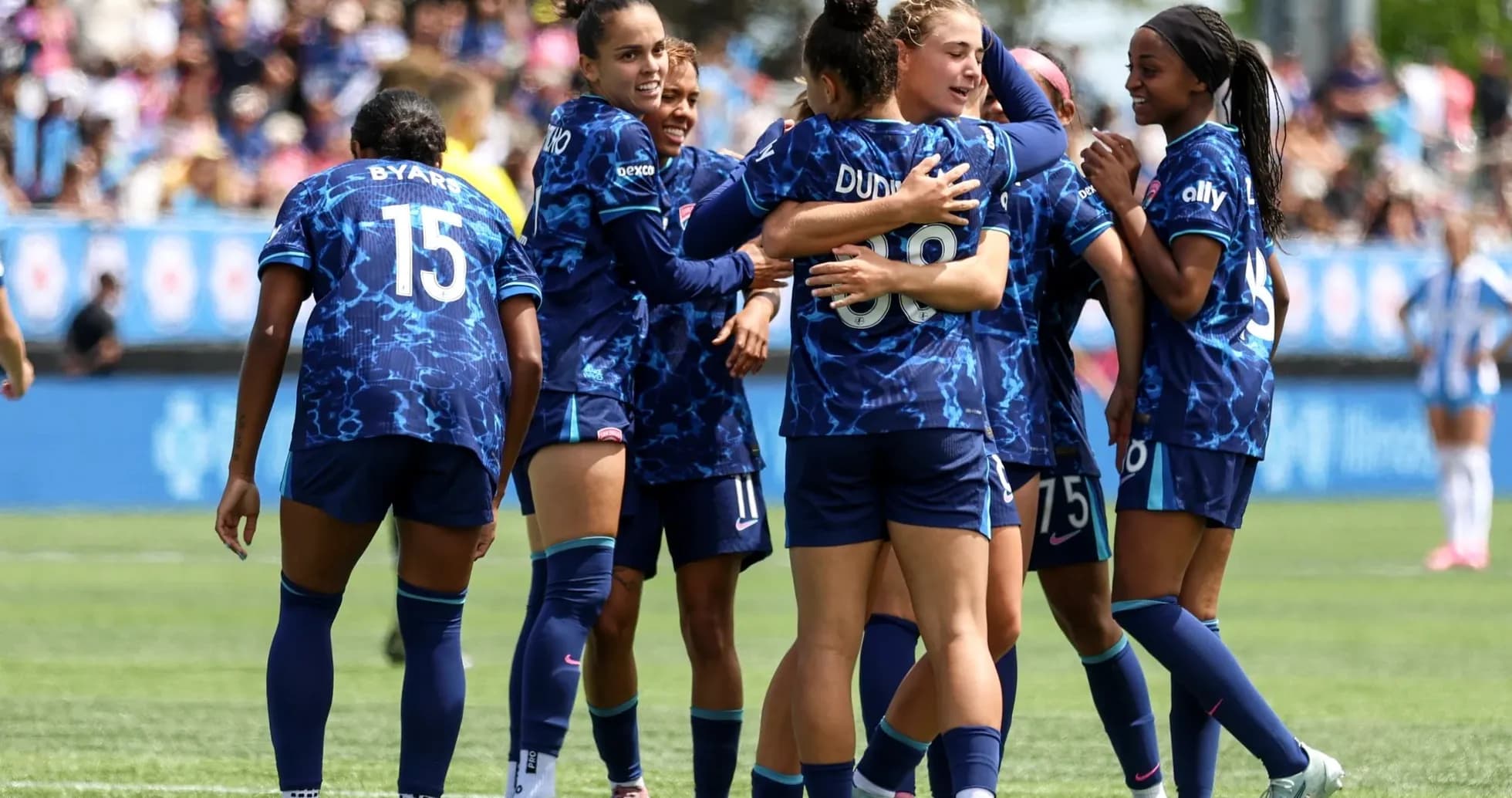 Seattle Reign FC players celebrating a goal