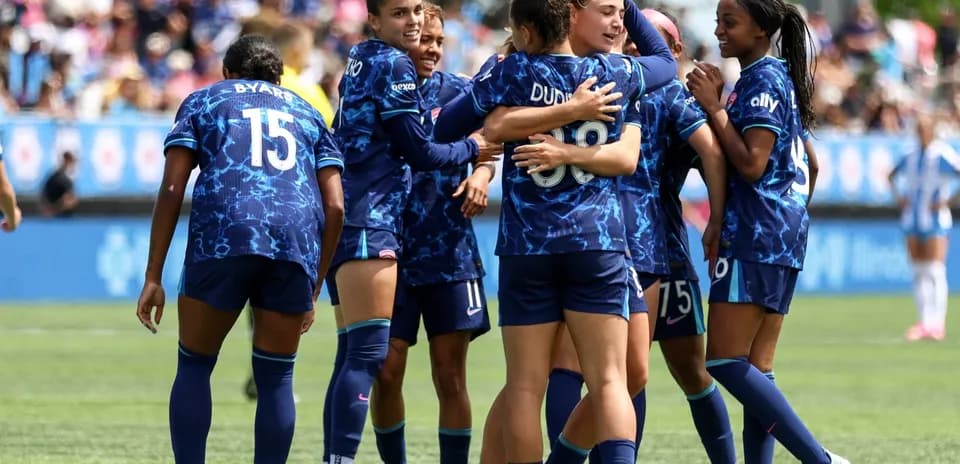 Seattle Reign FC players celebrating a goal