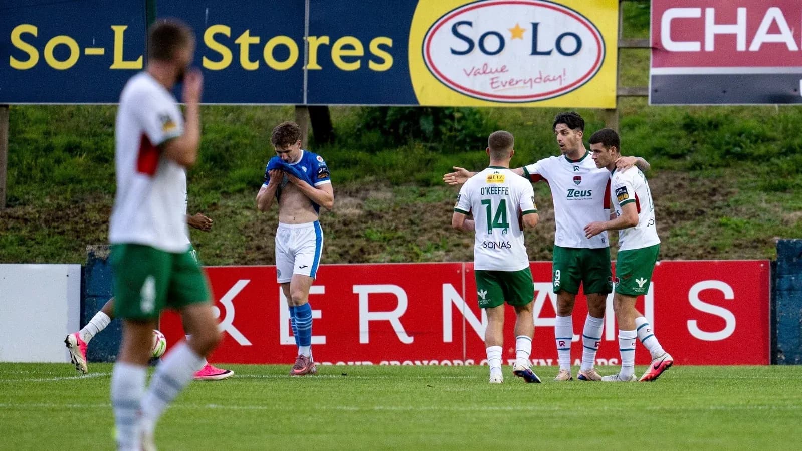 Players celebrating a goal on the pitch
