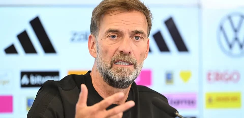 Manager speaking at press conference with gestures