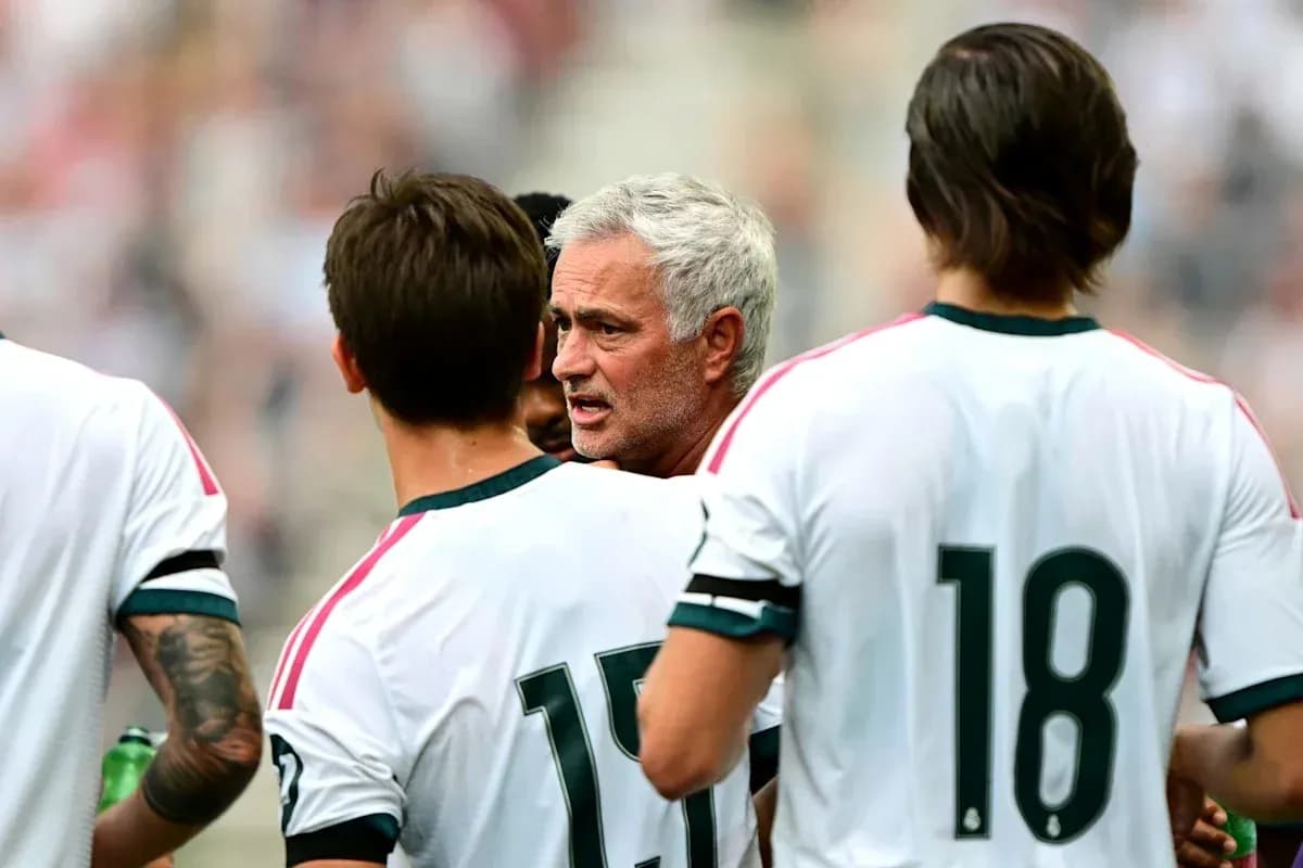 Manager discussing with players during team huddle
