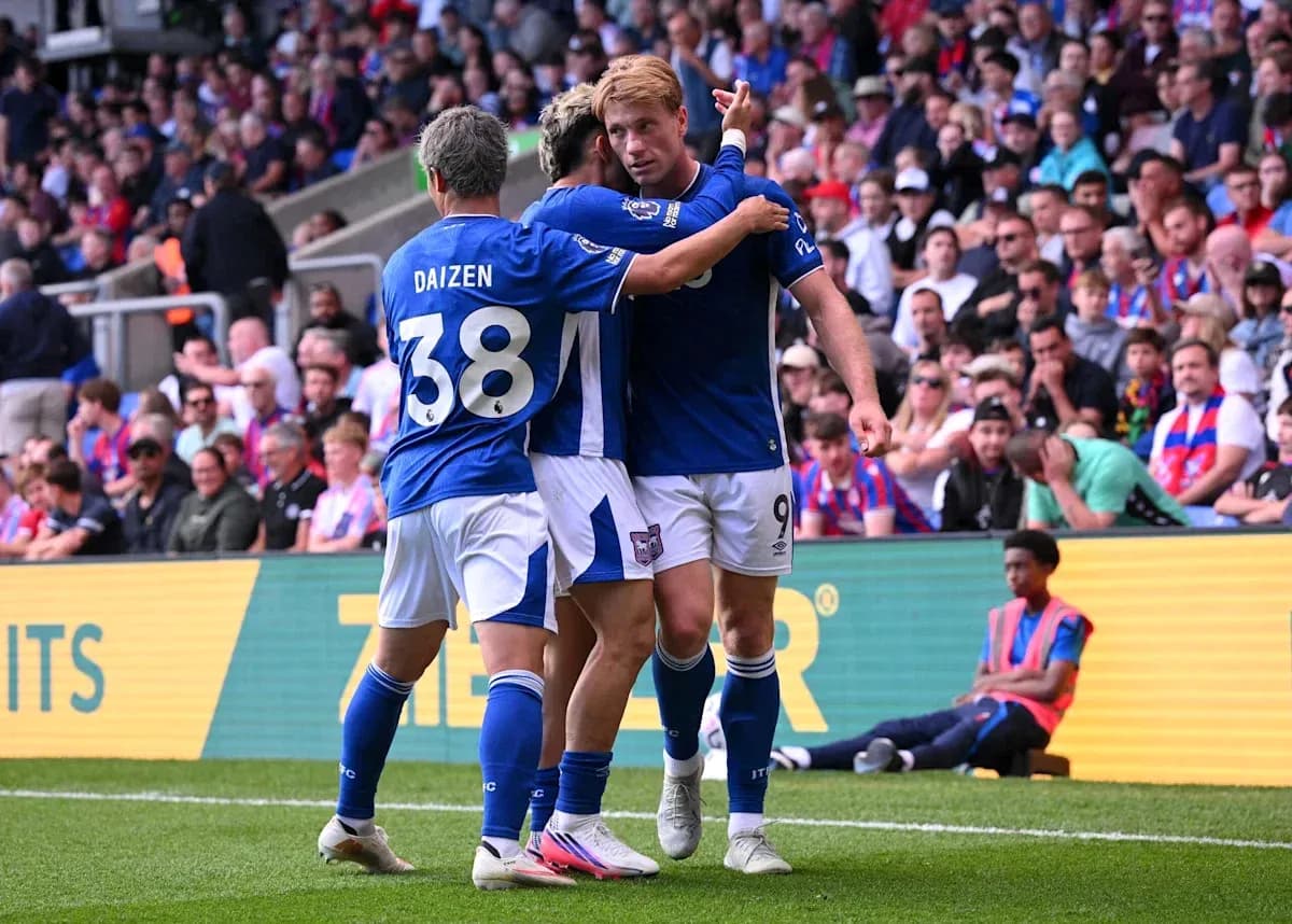 Players celebrating a goal on the pitch