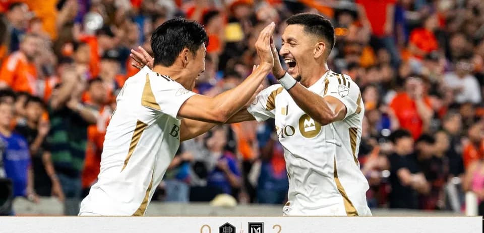 Players celebrating a goal during match