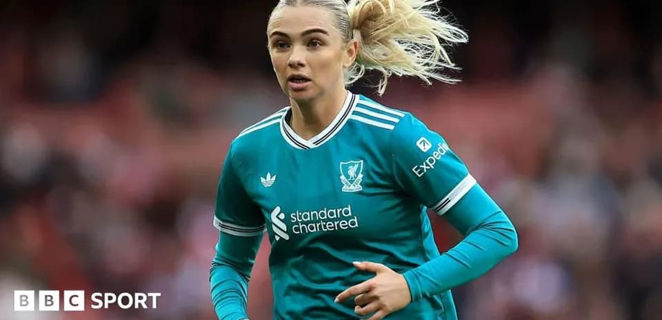 Player in Liverpool kit running on the pitch