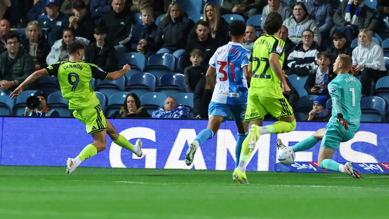 Player shooting on goal with goalkeeper approaching