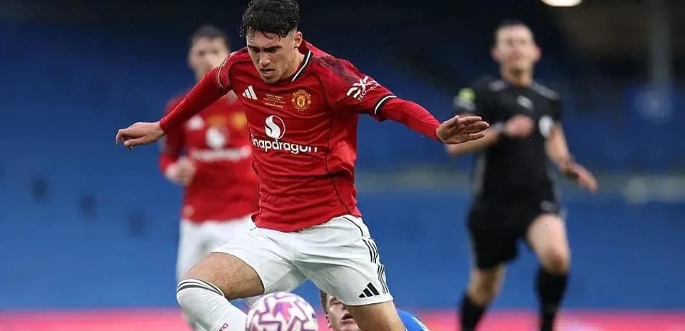 Player in red kit falls while playing football