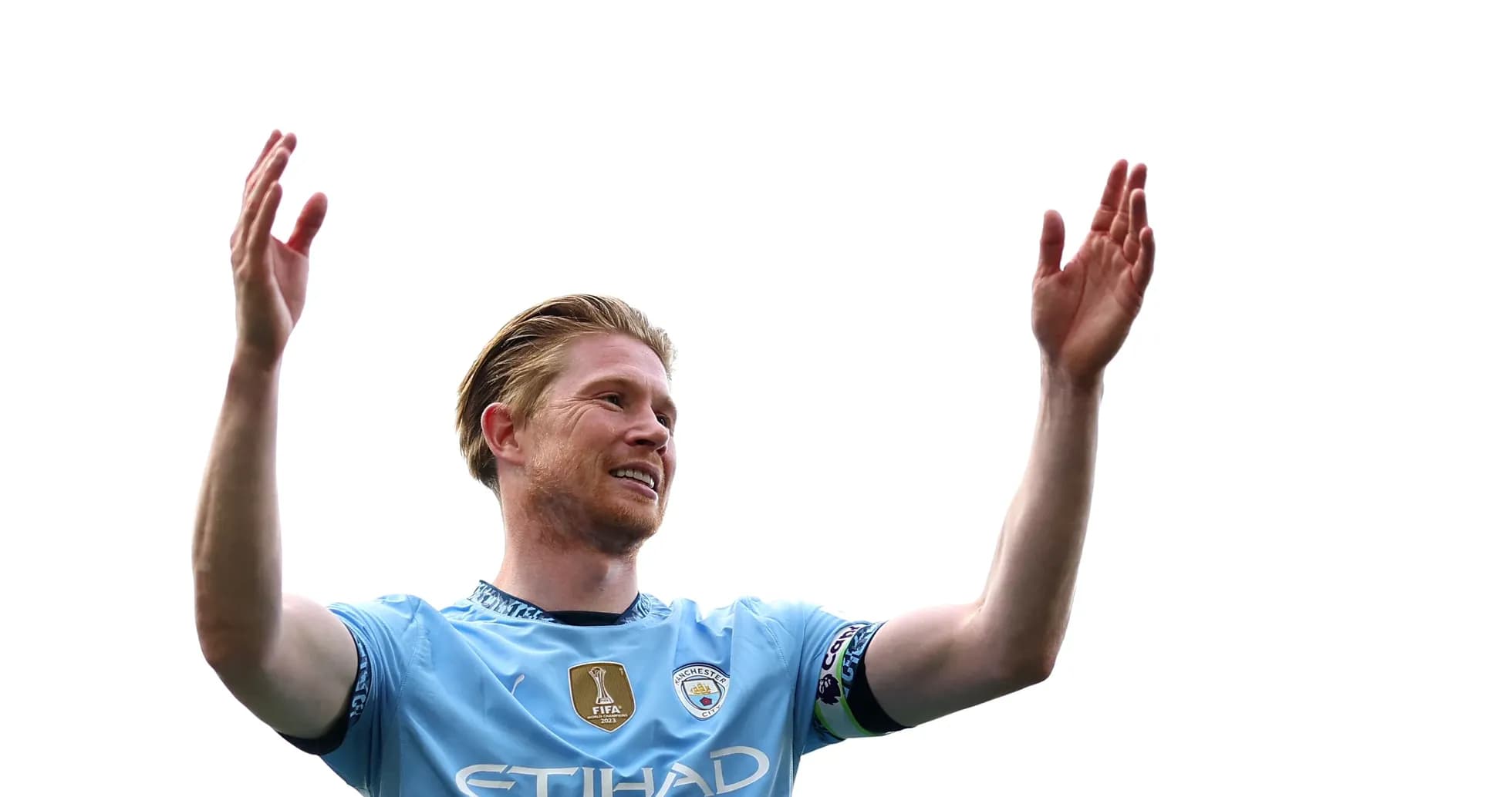 Player celebrating with raised arms in jersey