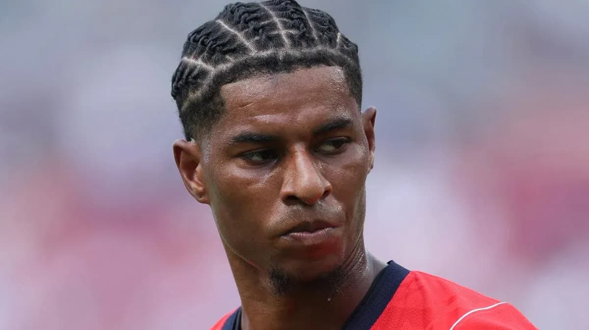 Player with braided hairstyle in red jersey