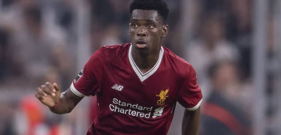 Player in Liverpool kit running on the pitch