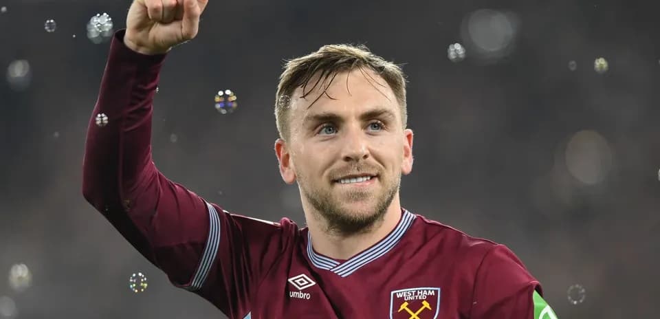 Player celebrating with raised fist in stadium