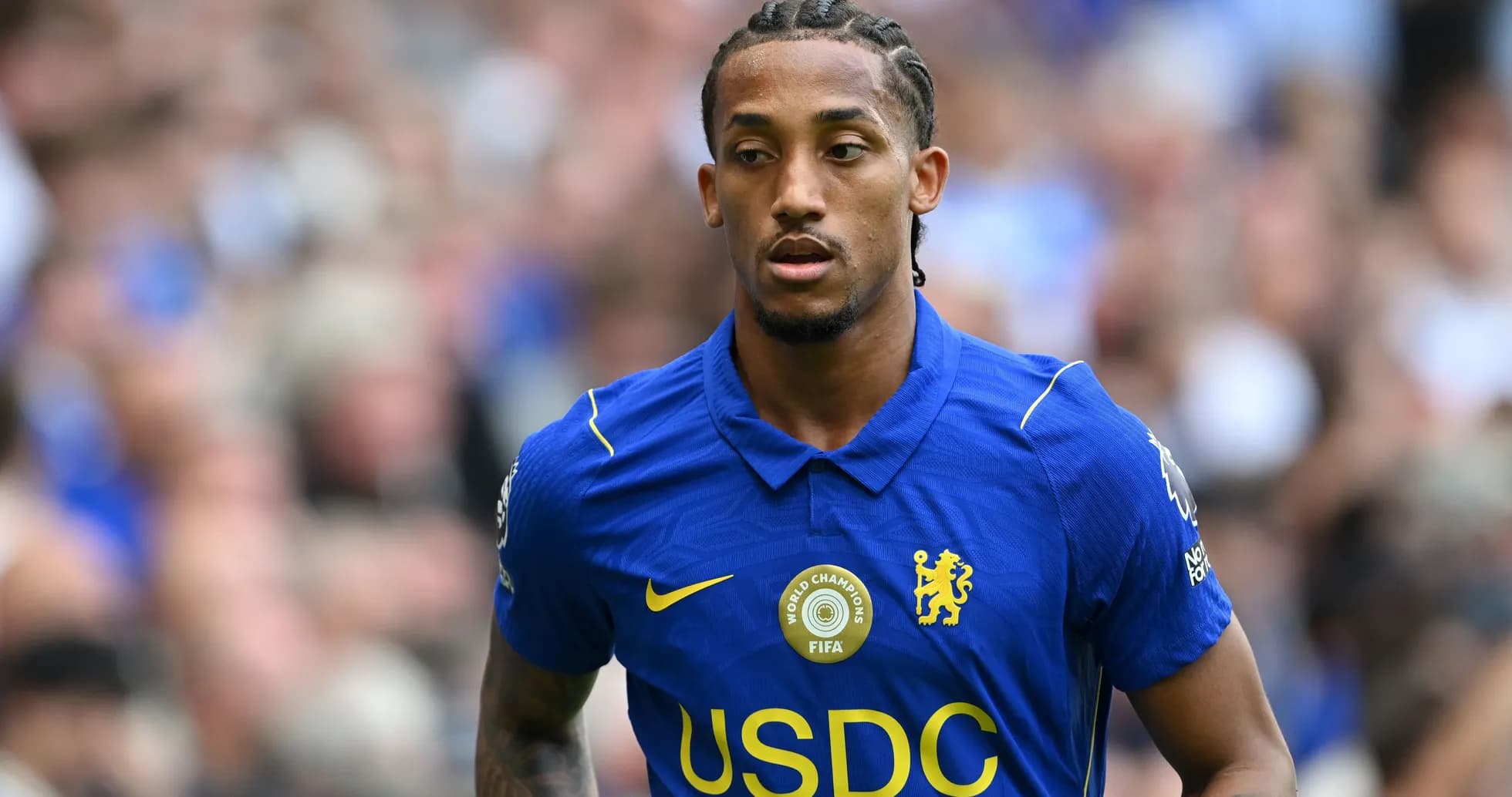 Player in blue Chelsea kit during match