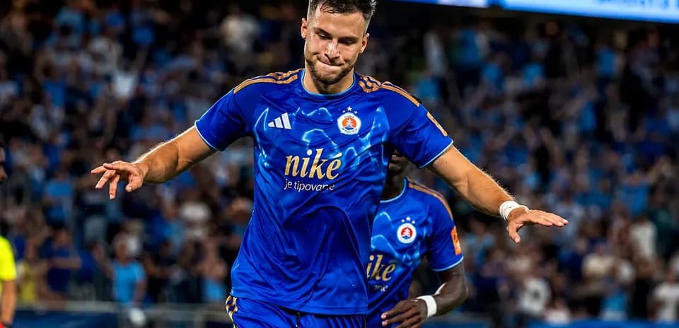 Player celebrating goal for Slovan Bratislava