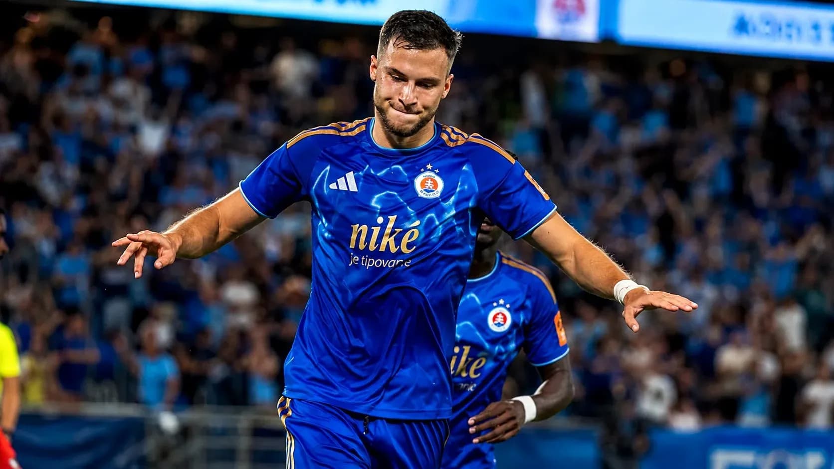 Player celebrating goal for Slovan Bratislava