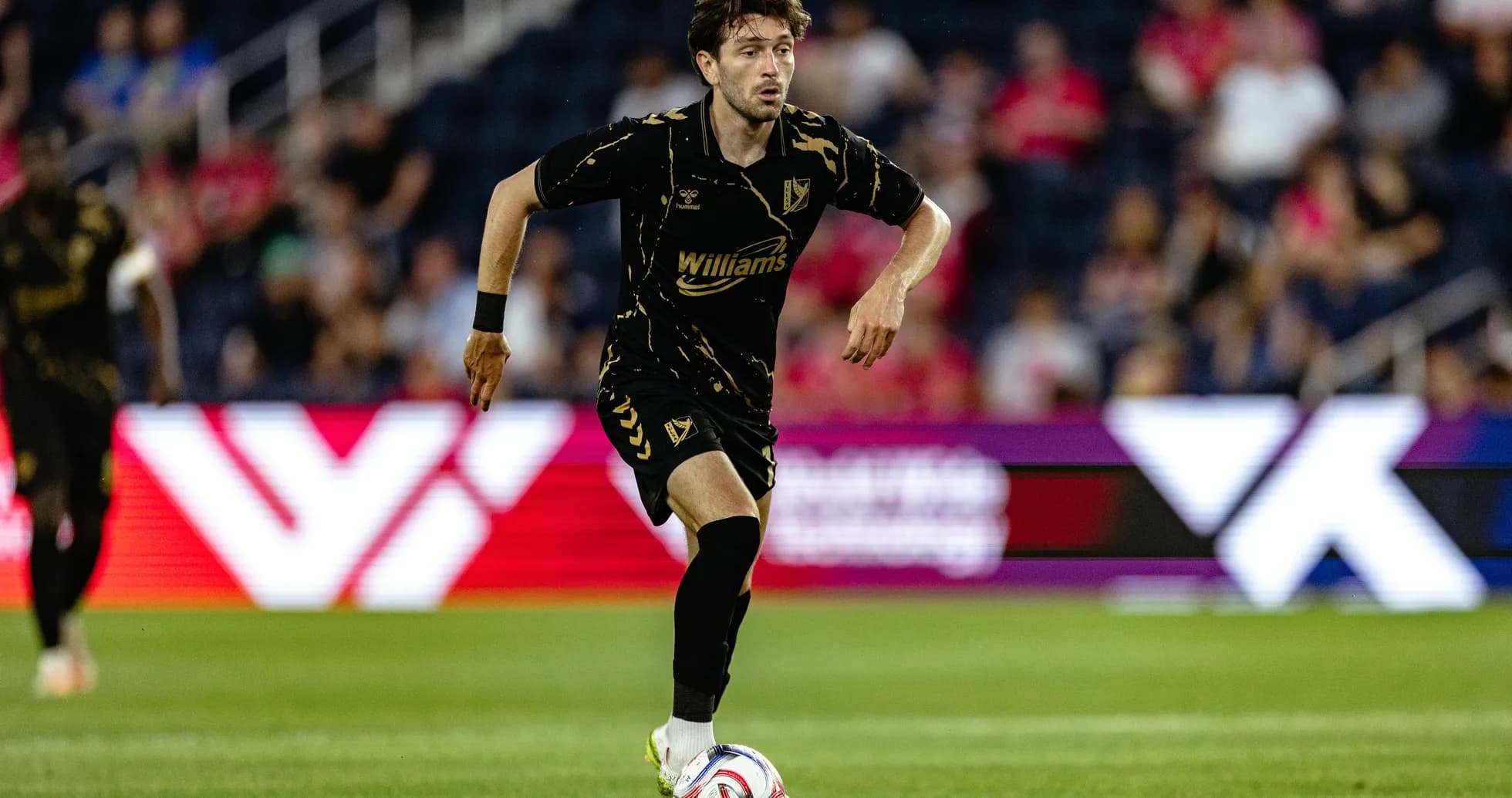 Player dribbling the ball during USL match