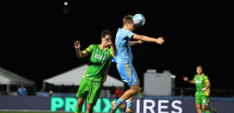 Player jumping for the ball during match