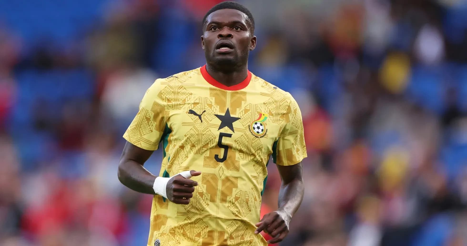 Player in Ghana national team jersey on field