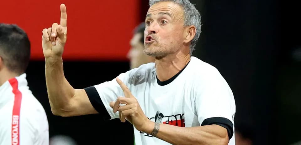 Coach gesturing during a match from the sidelines
