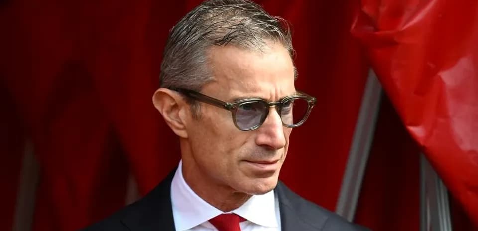 Man in glasses wearing a suit at event