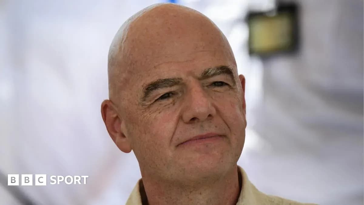 Man with bald head speaking at event
