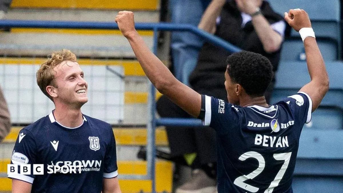 Dundee players celebrating a goal together